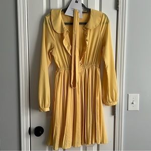 Yellow pleated dress